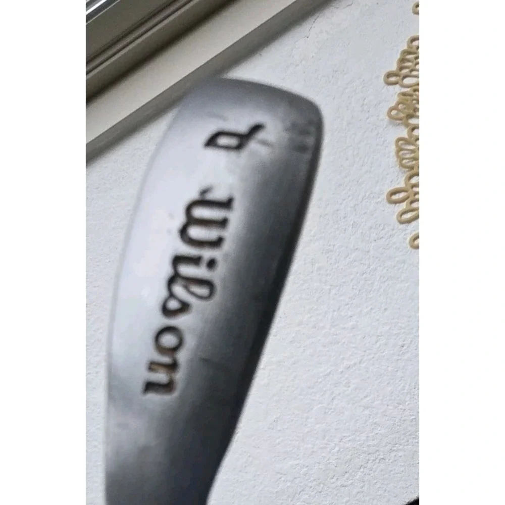 Wilson Ultra BLK iron, recognizable by the orange cavity.pitching Wedge 35.25